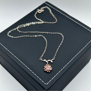 Sakura Silver Floral Charm Necklace with Polished Finish